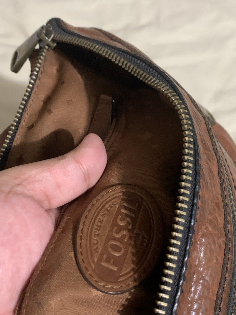 Fossil Leather Crossbody Bag (Category: Cross-body Bags) located in Makati City. Submitted by zzebraaa (Listing ID 1437783921, Image 3). Description: - Genuine Fossil crossbody bag - Rich brown leather - Multiple zippered compartments - Adjustable strap - Classic Fossil logo - Fossil logo interior lining - Stylish and practical.
