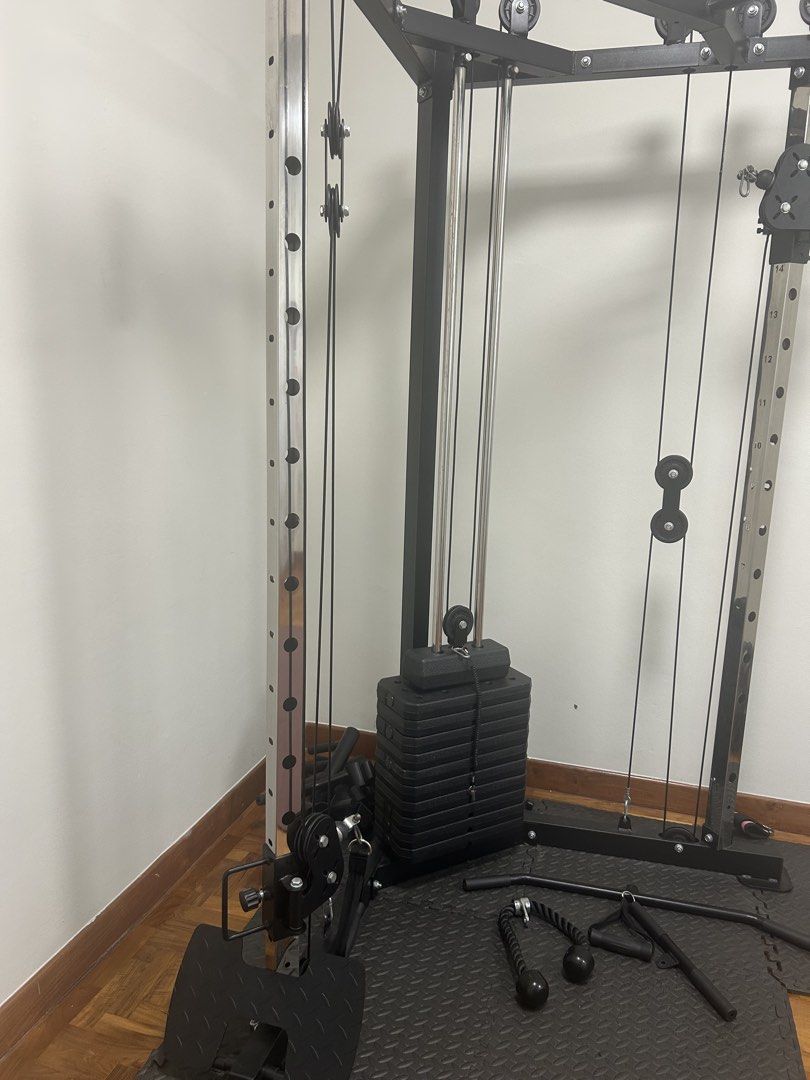 Functional Trainer Cable Machine (Category: Cardio & Fitness Machines) located in Singapore. Submitted by elijahgar53259 (Listing ID 1437767441, Image 2). Description: - High-quality functional trainer 72kg - Pick up, can help dismantle. - Includes various attachments - Perfect for home full-body workouts - Weights included.