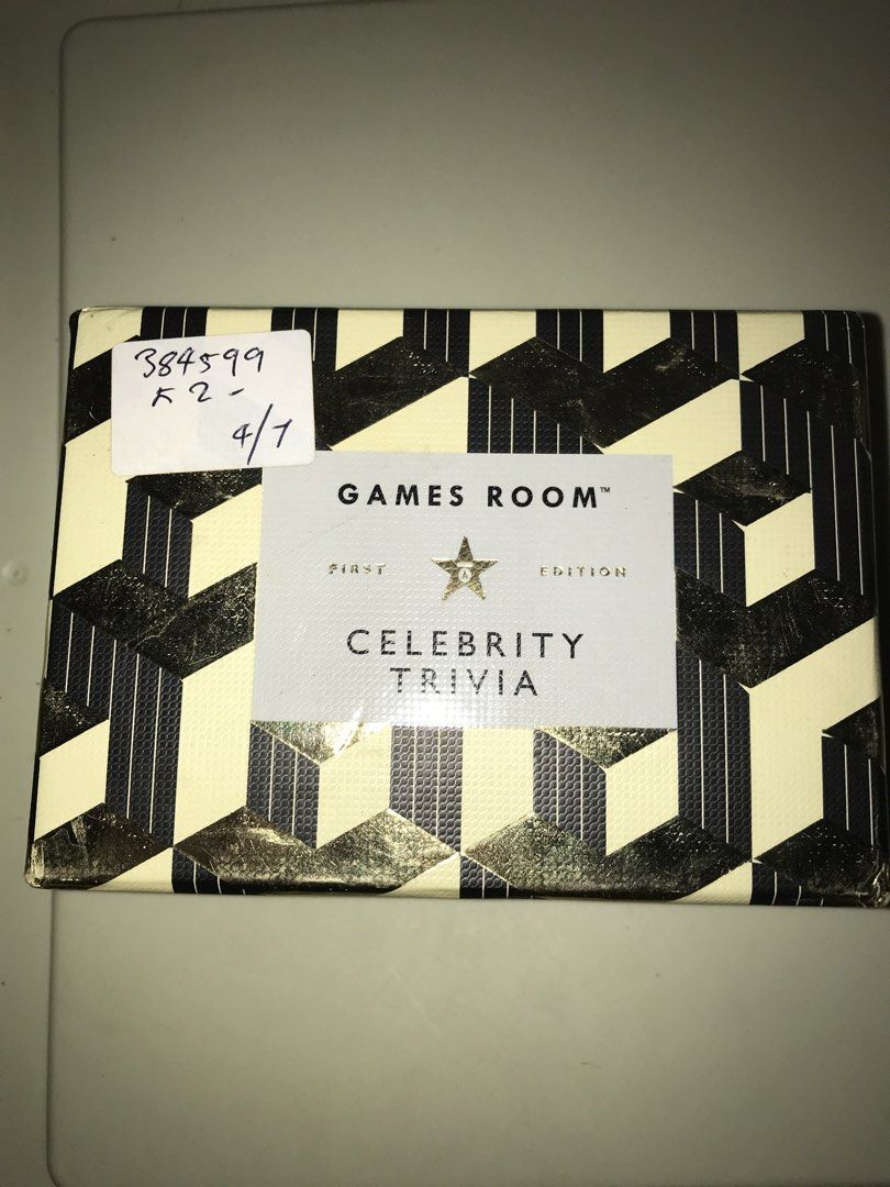Games Room Celebrity Trivia Game (Category: Board Games & Puzzles) located in Pilar. Submitted by dhelsomera20308 (Listing ID 1437848129, Image 1). Description: - Games Room Celebrity Trivia game - 140 question cards - Great for game nights with friends - Features celebrity and pop culture questions - Stylish box included - Ready to play.