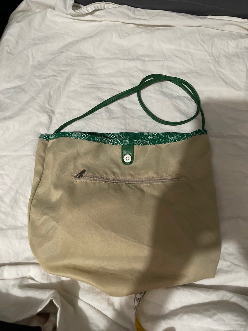 Green Bandana Tote Bag (Category: Tote Bags) located in Makati City. Submitted by afterpiece (Listing ID 1437914081, Image 3). Description: Green tote bag with bandana print. Features a leather-like bottom and straps. Spacious and stylish for everyday use..