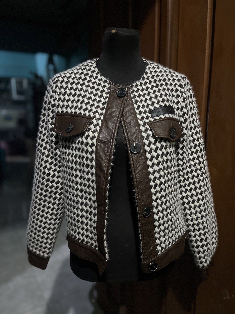 Houndstooth Pattern Jacket with Leather Accents (Category: Coats, Jackets and Outerwear) located in Cavite. Submitted by cvshops (Listing ID 1437880453, Image 3). Description: Super nice! Love this brown leather jacket kasi very bagay sa vibe ng daily outfits. I’m size Small-medium. This fits S-SemiL Slight scratches and leather damage on cuffs - Houndstooth pattern jacket - Brown leather accents - Round neckline - Button closure - Two front pock