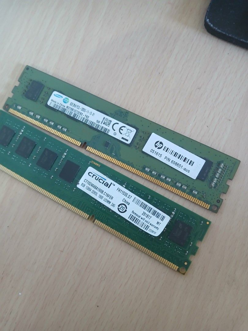 HP and Crucial RAM Sticks (Category: Desktops) located in Manila. Submitted by livehawk-0850 (Listing ID 1437851162, Image 1). Description: - HP RAM stick with serial number 696651-003 - Crucial RAM stick, model CT102464BA160B.M16FR, serial number C105008041618 - Both sticks are green - Various labels with information on both sticks.