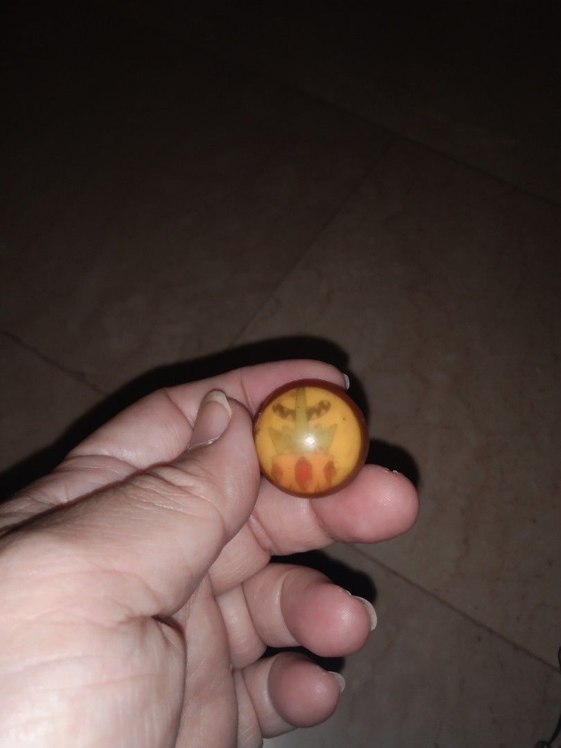 Jackstone ball king adventure time (Category: Vintage Collectibles) located in Quezon City. Submitted by eidorableshop (Listing ID 1437928516, Image 1). Description: - Vintage marble - Unique marbled design - Colors: Orange, yellow, and brown - Round shape - Glass-like appearance - Classic toy or collectible item.