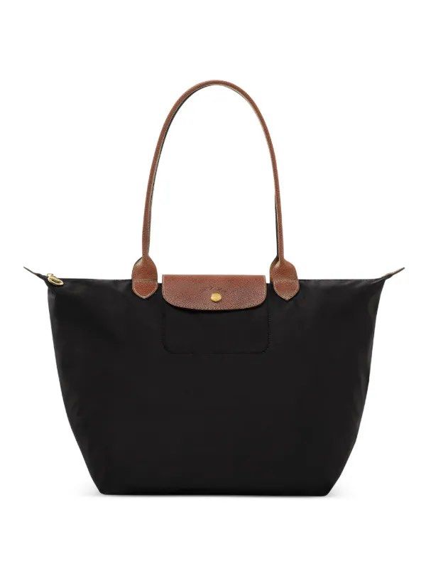 Longchamp Le Pliage Tote Bag - Black (Category: Luxury Bags & Wallets) located in Arayat. Submitted by declutter.aki (Listing ID 1437920895, Image 1). Description: - Classic Longchamp Le Pliage tote bag in black. - Large - Used twice in when I was in Hk - Bought in Hk.