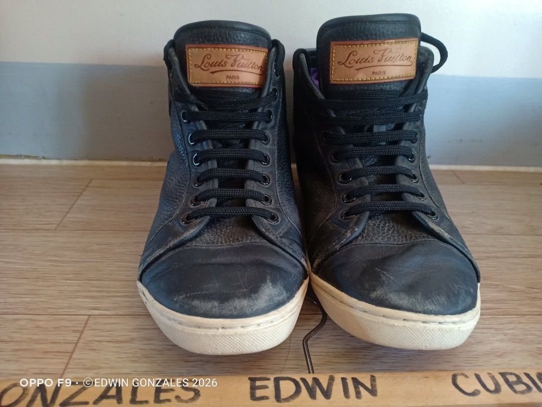 Louis Vuitton Black Leather Size 43 (Category: Casual Shoes) located in Nasipit. Submitted by edwingonzales498-69377 (Listing ID 1437934506, Image 3). Description: -Louis Vuitton high-top sneakers - Black leather - Iconic LV logo detail - Lace-up closure - White sole - Signs of wear on leather and soles - Includes Louis Vuitton label.
