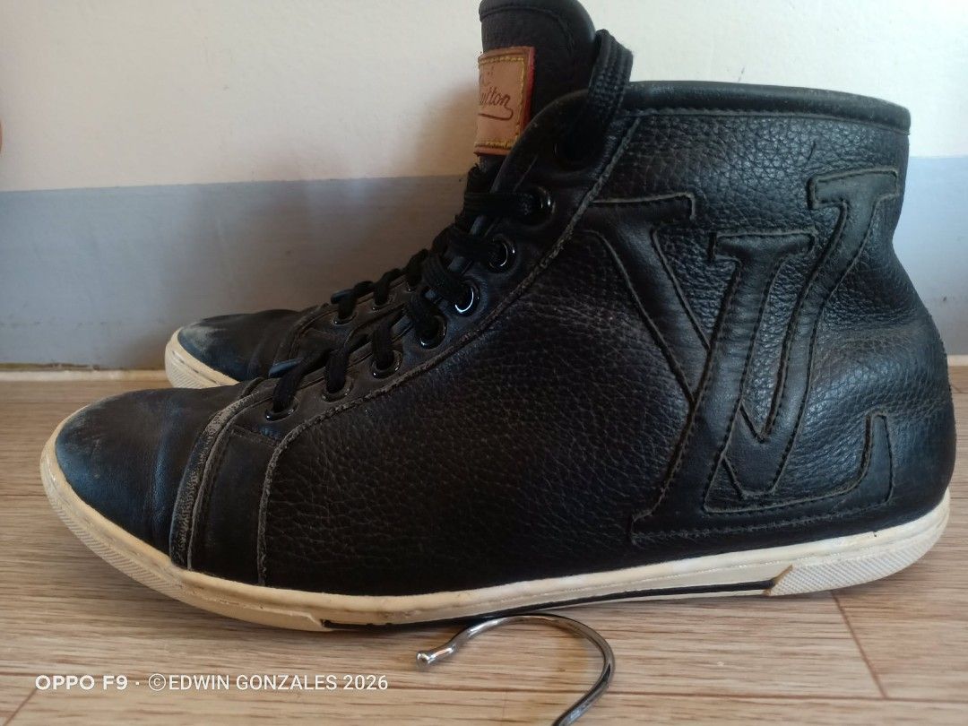Louis Vuitton Black Leather Size 43 (Category: Casual Shoes) located in Nasipit. Submitted by edwingonzales498-69377 (Listing ID 1437934506, Image 1). Description: -Louis Vuitton high-top sneakers - Black leather - Iconic LV logo detail - Lace-up closure - White sole - Signs of wear on leather and soles - Includes Louis Vuitton label.