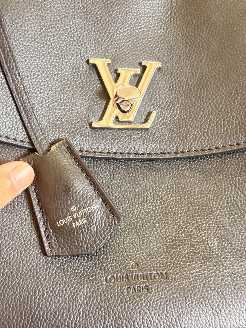 Louis Vuitton City Steamer Handbag (Category: Luxury Bags & Wallets) located in Taguig. Submitted by ara0813 (Listing ID 1437928952, Image 3). Description: - Authentic Louis Vuitton lockme ever BB handbag - Elegant dark color - Features a top handle - Secure flap closure with metal LV logo - Includes a detachable tag - Comes with a dust bag - Crafted from leather.