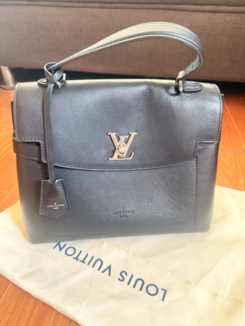 Louis Vuitton City Steamer Handbag (Category: Luxury Bags & Wallets) located in Taguig. Submitted by ara0813 (Listing ID 1437928952, Image 1). Description: - Authentic Louis Vuitton lockme ever BB handbag - Elegant dark color - Features a top handle - Secure flap closure with metal LV logo - Includes a detachable tag - Comes with a dust bag - Crafted from leather.