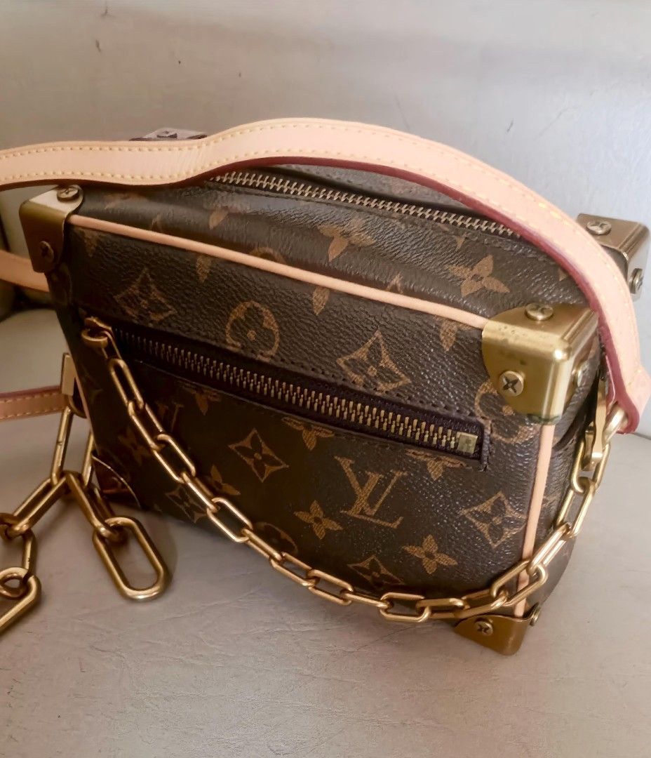 Louis Vuitton Mini Soft Trunk Bag (Category: Luxury Bags & Wallets) located in Victoria. Submitted by Kristoff_007 (Listing ID 1437786023, Image 1). Description: Dimensions:18 x 12 x 7 cm monogram canvas body with leather trim flat vachetta leather and chain strap top zip closure exterior front zip pocket interior slip pocket brown Condition: GOOD. This previously owned and used item is in good condition with minimal signs of use. This may includ