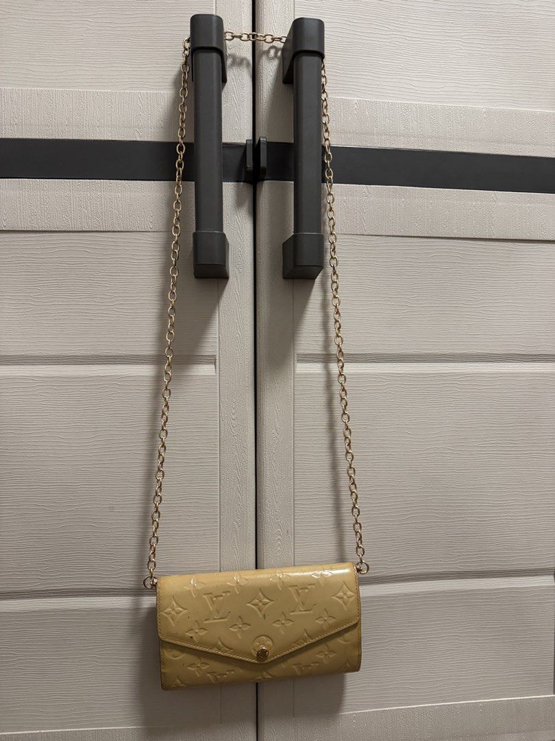 Louis Vuitton Monogram Vernis Chain Wallet (Category: Luxury Bags & Wallets) located in Caloocan City. Submitted by r_h_e_a10 (Listing ID 1437870965, Image 3). Description: - Authentic Louis Vuitton Monogram Vernis chain wallet - Gold-tone chain strap - Snap closure - Interior with multiple compartments and card slots - Iconic LV monogram pattern - Made in France.