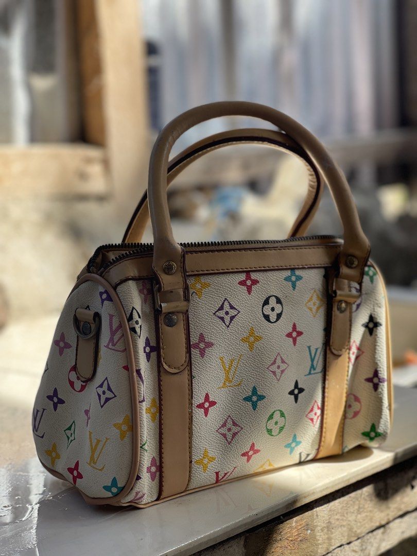 Louis Vuitton Multicolor Speedy Bag (Category: Luxury Bags & Wallets) located in Manila. Submitted by certhrified_legit21 (Listing ID 1437861326, Image 2). Description: - Authentic Louis Vuitton Speedy bag - Multicolor design - Zip closure - Dual top handles - Spacious interior - Iconic LV monogram pattern - Made in France - Leather interior with brand label - Zipper with LV logo.