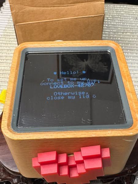 Lovebox - Pixel Heart Edition (Category: Google Pixel) located in Baguio. Submitted by gokubusansan (Listing ID 1437895642, Image 2). Description: - Wooden Lovebox with pixel heart design. - Connects to WiFi. - Displays messages and graphics. - Example message: "I love you Fi". - Connect to WiFi network: LOVEBOX-42707. - Currently updating..