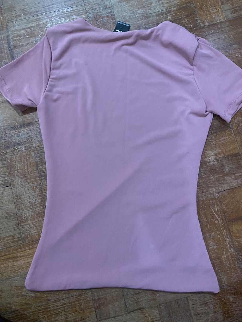 Mera Pink T-shirt - Size S (Category: Shirts) located in Manila. Submitted by boomboomshakataka (Listing ID 1437870059, Image 3). Description: - Pink Mera T-shirt - Size: S - Made in the Philippines - Features: - Round neck - Short sleeves - Fitted silhouette - Brand new with tag.