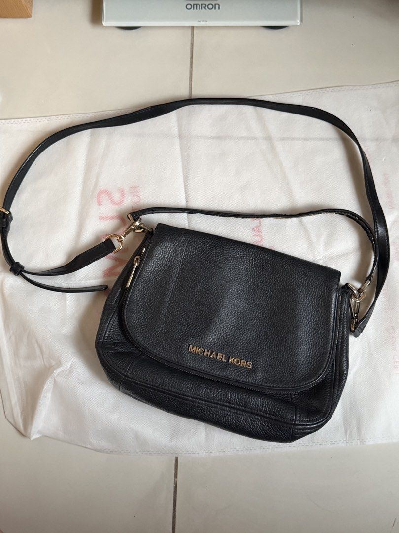 Michael Kors Black Crossbody Bag (Category: Luxury Bags & Wallets) located in Manila. Submitted by mcpmcp (Listing ID 1437854510, Image 2). Description: 2-way authentic MK bag - kili-kili bag & sling bag in 1 - Zip closure - Adjustable long strap - Interior lined with Michael Kors logo pattern - Gold-tone hardware with bakbak - Minor wear on strap - Some scratches on hardware - Made of leather -vintage RFS: Decluttering. Haven’t used in 6 years! 