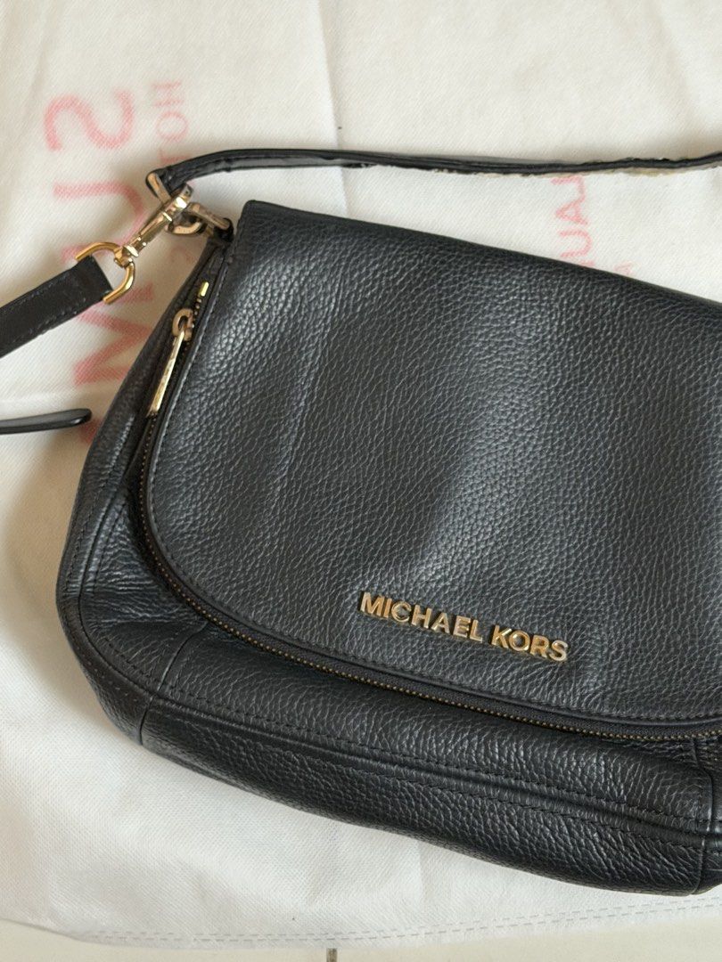 Michael Kors Black Crossbody Bag (Category: Luxury Bags & Wallets) located in Manila. Submitted by mcpmcp (Listing ID 1437854510, Image 1). Description: 2-way authentic MK bag - kili-kili bag & sling bag in 1 - Zip closure - Adjustable long strap - Interior lined with Michael Kors logo pattern - Gold-tone hardware with bakbak - Minor wear on strap - Some scratches on hardware - Made of leather -vintage RFS: Decluttering. Haven’t used in 6 years! 