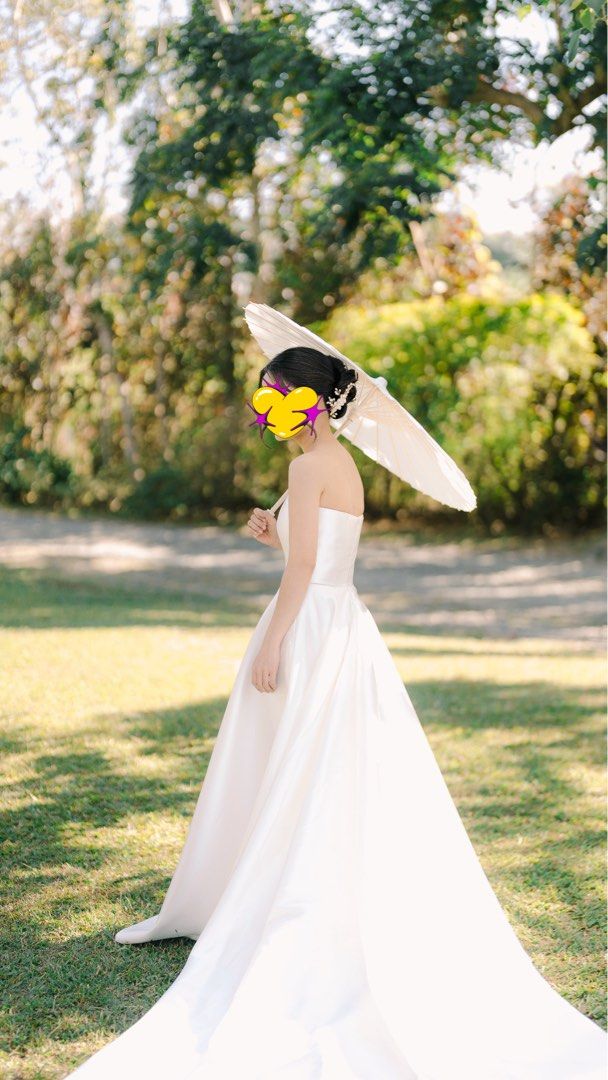 Minimalist Mikado Wedding Gown (Category: Evening dresses & gowns) located in Paranaque City. Submitted by meow_1222 (Listing ID 1437928956, Image 2). Description: Minimalist mikado wedding gown Worn last February 26, 2026 🌸 In excellent condition 🌸 Overlap skirt, with pockets 🌸 Measurements: 31 in bust, 25 in waist, 56 in Gown FL (bride in pic is 5 flat wearing 3.9 in heels) 🌸 Professionally dry cleaned, no more box/receipt (from Disenyo Pan