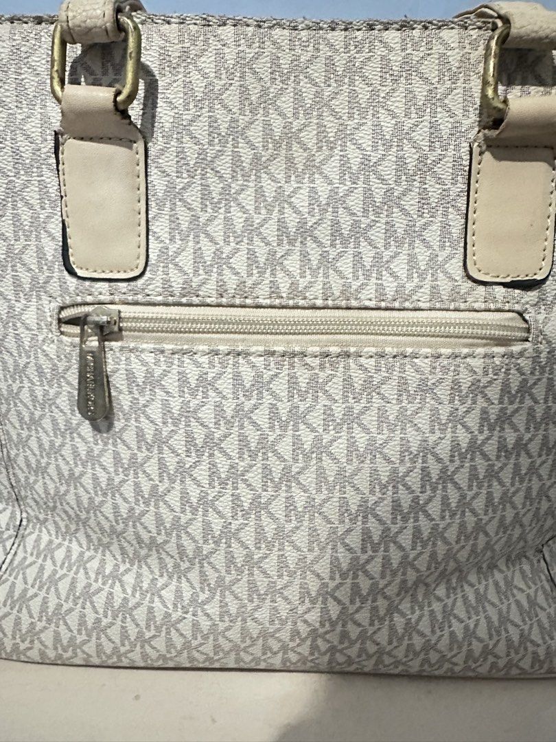 MK TOTE BAG (signature MK) (Category: Tote Bags) located in Manila. Submitted by rheineivory (Listing ID 1437882897, Image 3). Description: heavenly used, had some issues but still usable, with mk tag inside, price is negotiable. Open for trades, 550+sf.