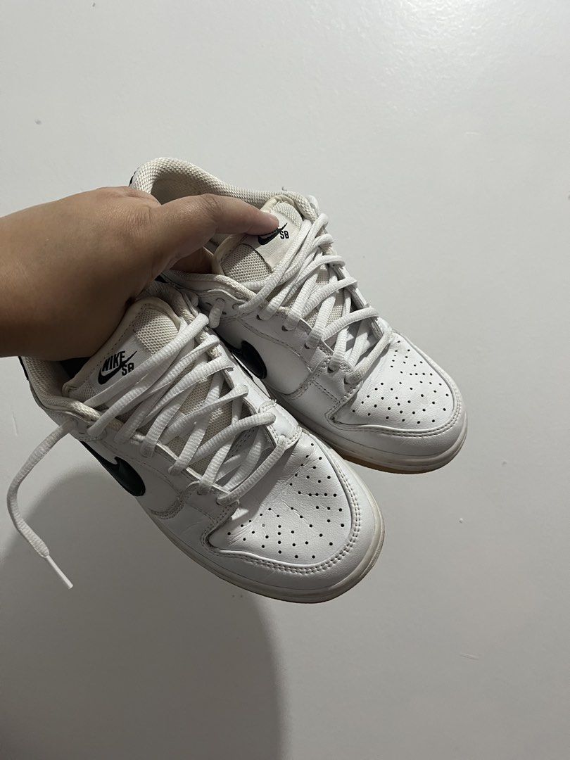 Nike SB Dunk Low White Black (Category: Sneakers) located in Manila. Submitted by chinieannjocel (Listing ID 1437794101, Image 3). Description: RUSH SELL! - White Nike SB Dunk Low - Black swoosh - White laces - Perforated toe box - Nike SB logo on tongue - Clean and ready to wear - Some wear on soles.