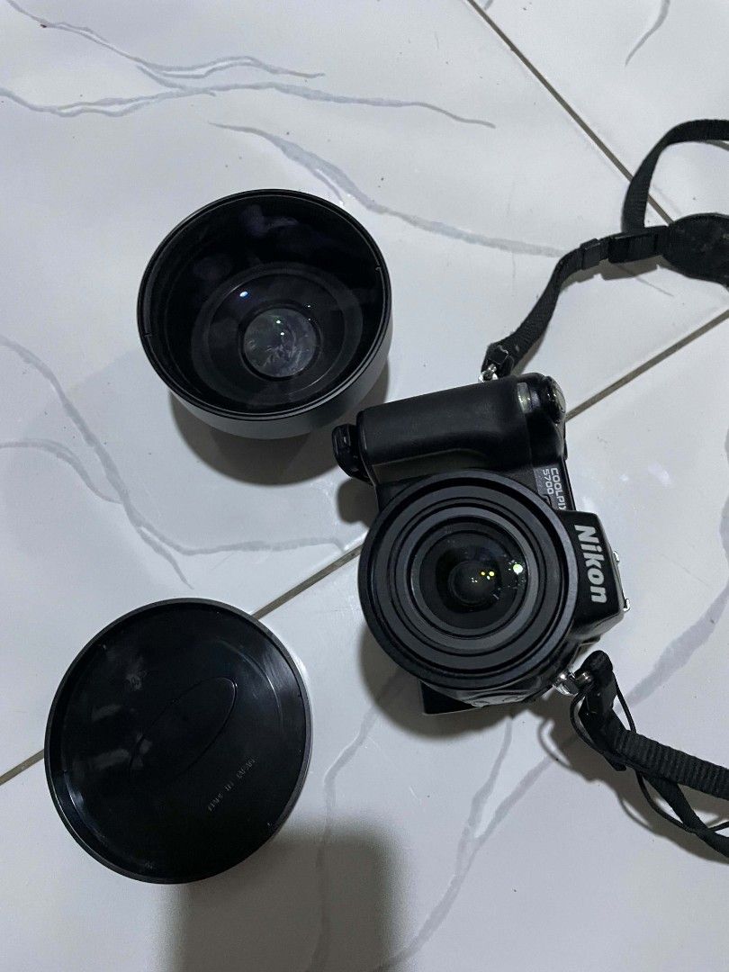 Nikon Coolpix Camera with Lens Cap (Category: Cameras) located in Valenzuela. Submitted by octobow (Listing ID 1437910964, Image 1). Description: Nikon coolpix 5700 Defective or for parts with wide angle lens converter Sira Lcd, rubber pads degrade lens dumi. Selling as defective 700 No return, just decluttering.
