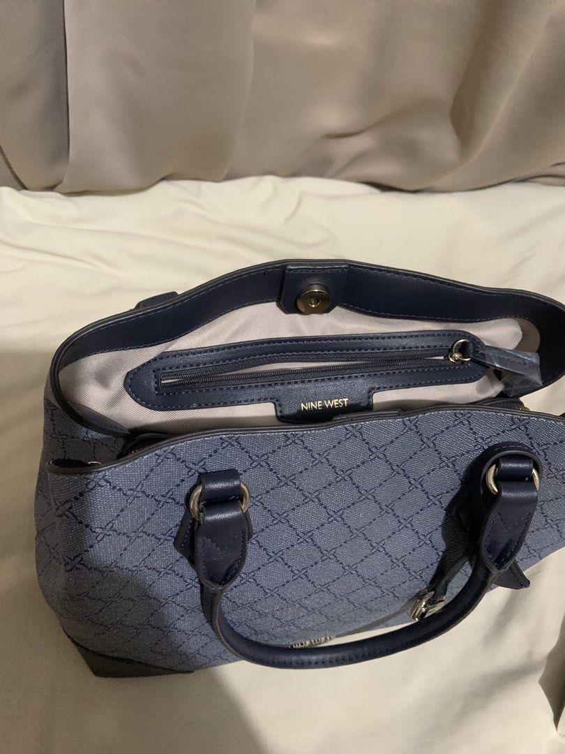 Nine West Handbag with Lock Detail (Category: Shoulder Bags) located in Makati City. Submitted by zzebraaa (Listing ID 1437781810, Image 3). Description: - Nine West handbag - Geometric pattern - Top handle and detachable shoulder strap - Lock detail - Zippered main compartment - Interior slip pocket and zippered pocket - Darker base and handle accents - Magnetic closure.