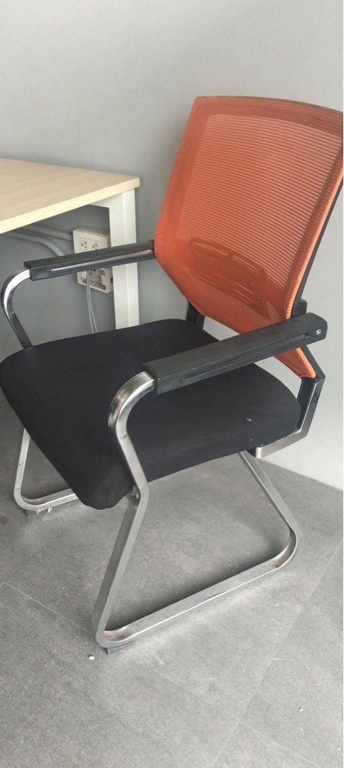 Office Chair with Orange Mesh Back 600pcs Available (Category: Office Furniture & Fixtures) located in Manila. Submitted by marquezpa52205 (Listing ID 1437860247, Image 1). Description: - Black seat and orange mesh back for breathability - Includes armrests - Chrome-colored frame - Suitable for office or home use.