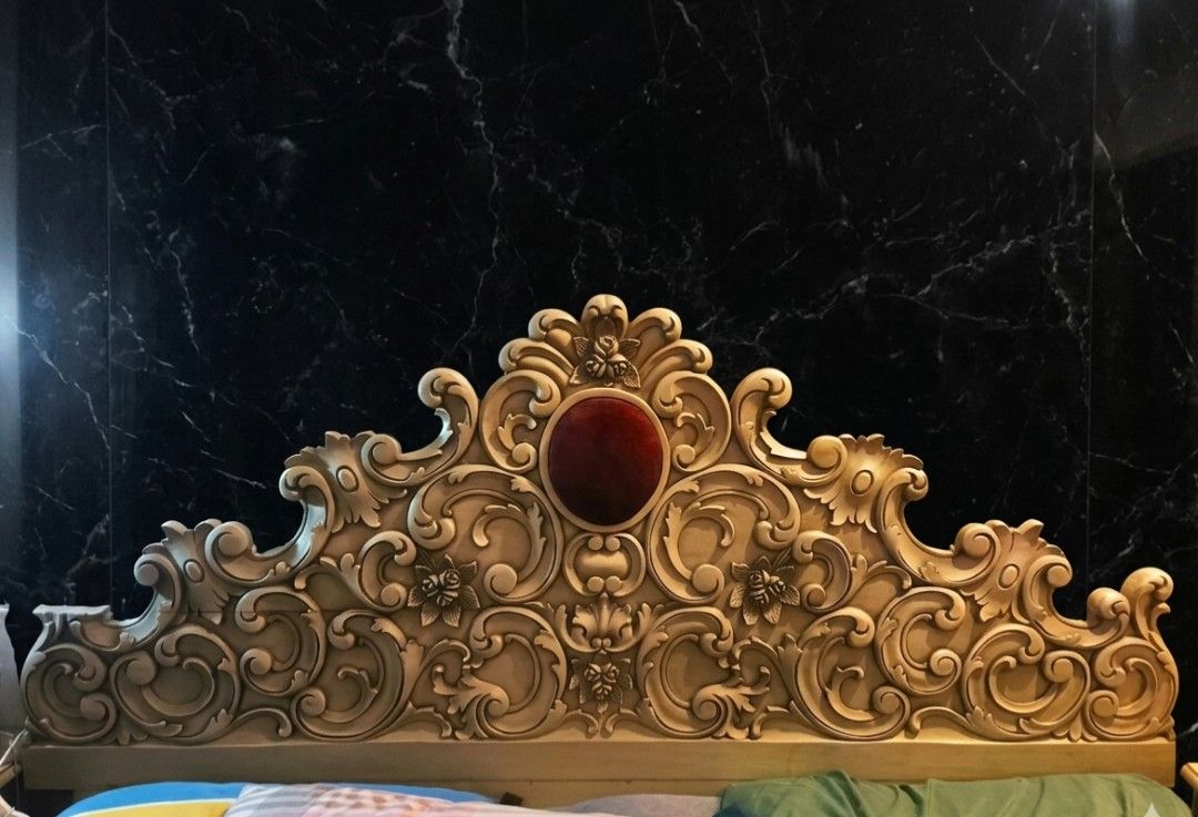 Narra Ornate Carved Bed Headboard and Side Table (Category: Bed Frames & Mattresses) located in Quezon City. Submitted by jannizjae (Listing ID 1437835102, Image 1). Description: - Elegant bed headboard with intricate carvings and red velvet accent. - Matching 2 pcs side table with detailed carvings. - Nightstand includes a drawer and cabinet for storage. - Vintage aesthetic with a light, distressed finish. - Headboard designed to fit a King bed 
