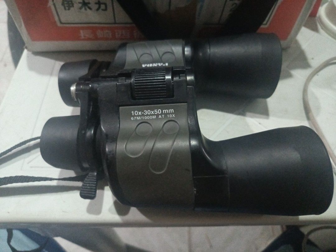 Panda 10x-30x50 mm Binoculars (Category: Lens & Kits) located in Cebu City. Submitted by turuuru8992423 (Listing ID 1437849719, Image 3). Description: Panda 10x-30x50mm Zoom Binoculars Description: Selling these Panda brand zoom binoculars. Great for general viewing, bird watching, or outdoor use. The body shows some signs of use but is solid and comes with the neck strap attached as seen in the images. Condition & Functionality: Optics: Clear le