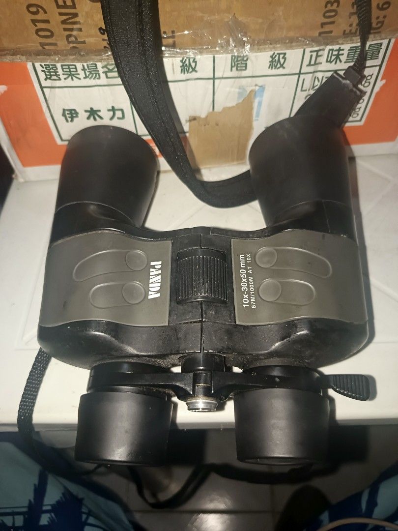 Panda 10x-30x50 mm Binoculars (Category: Lens & Kits) located in Cebu City. Submitted by turuuru8992423 (Listing ID 1437849719, Image 1). Description: Panda 10x-30x50mm Zoom Binoculars Description: Selling these Panda brand zoom binoculars. Great for general viewing, bird watching, or outdoor use. The body shows some signs of use but is solid and comes with the neck strap attached as seen in the images. Condition & Functionality: Optics: Clear le