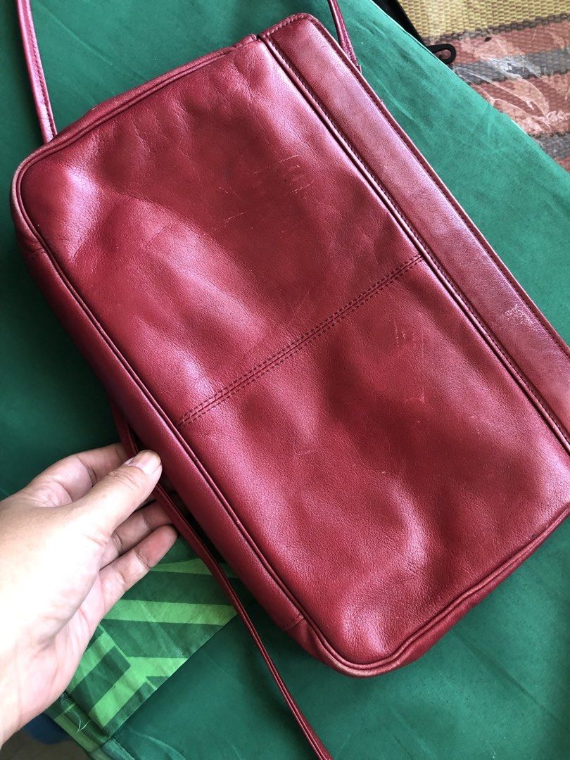Pascale Crochon Red Quilted Shoulder Bag (Category: Shoulder Bags) located in Tabuk. Submitted by qurst (Listing ID 1437811872, Image 2). Description: - Pascale Crochon shoulder bag - Red color - Quilted front design - Smooth leather back - Features a long shoulder strap - Embossed brand name - Made of leather - Rectangular shape.