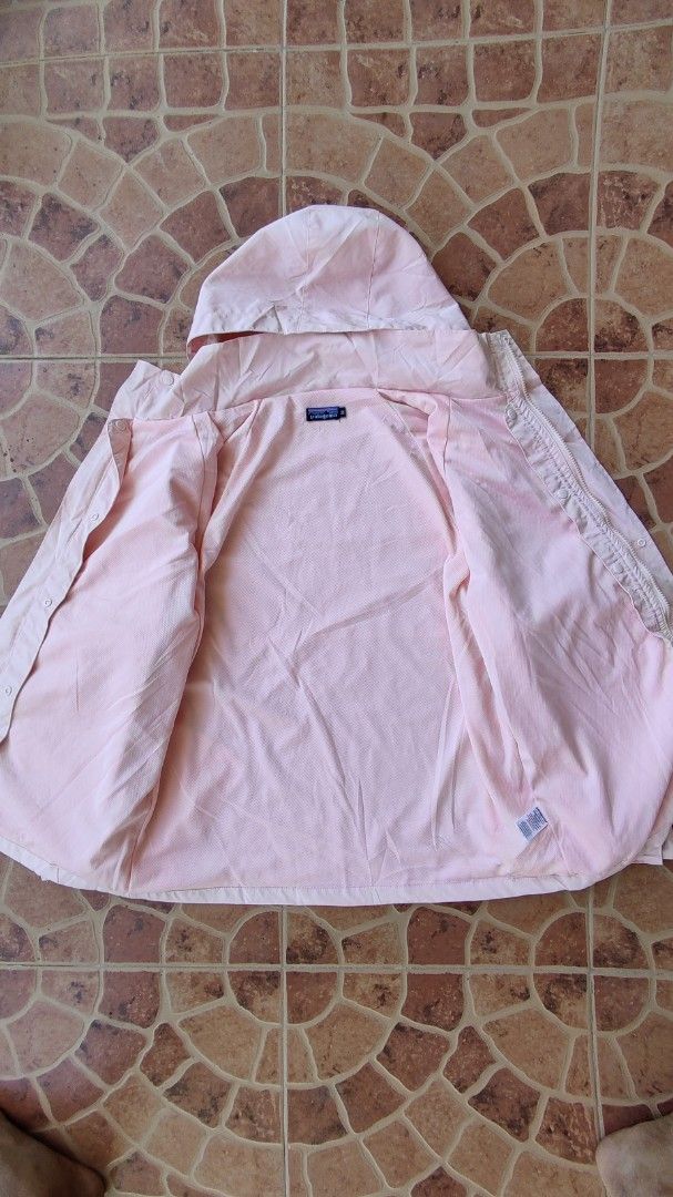 Patagonia Pink Jacket with Hood (Category: Coats, Jackets and Outerwear) located in Manila. Submitted by thriftafinds (Listing ID 1437908164, Image 3). Description: - Patagonia pink jacket - Size: M - Features a hood and full-length zipper - Small Patagonia logo on chest - Interior: Light pink mesh - Made in Sri Lanka.