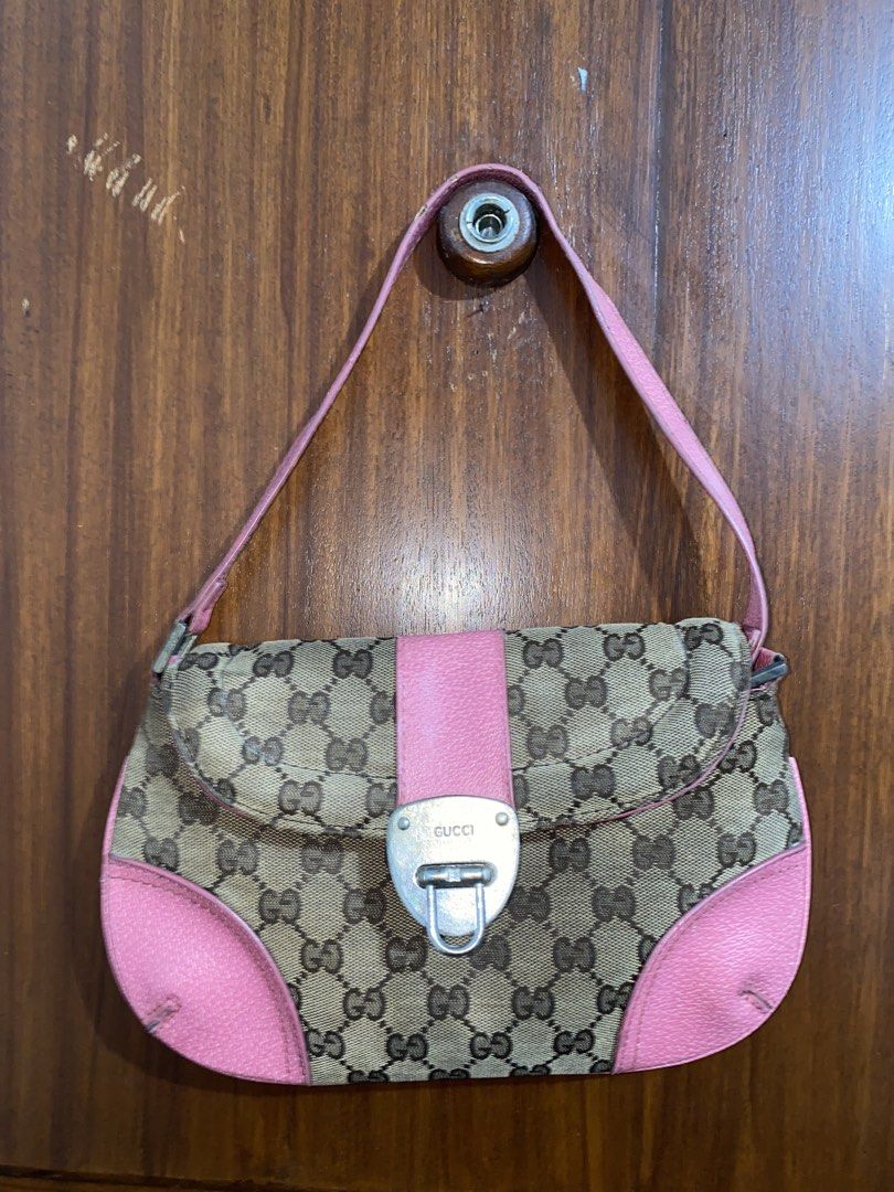 Preloved Vintage Gucci Shoulder Bag (Category: Luxury Bags & Wallets) located in Mandaluyong City. Submitted by sheichichioco (Listing ID 1437786266, Image 1). Description: Selling my preloved Vintage Y2K-style Gucci monogram shoulder bag with pink leather trim Honest issue: Damage front lock Noticeable wear on the hardware and some aging Overall the canvas and shape still look decent. Still useable and can be restored RFS: Decluttering Price is 