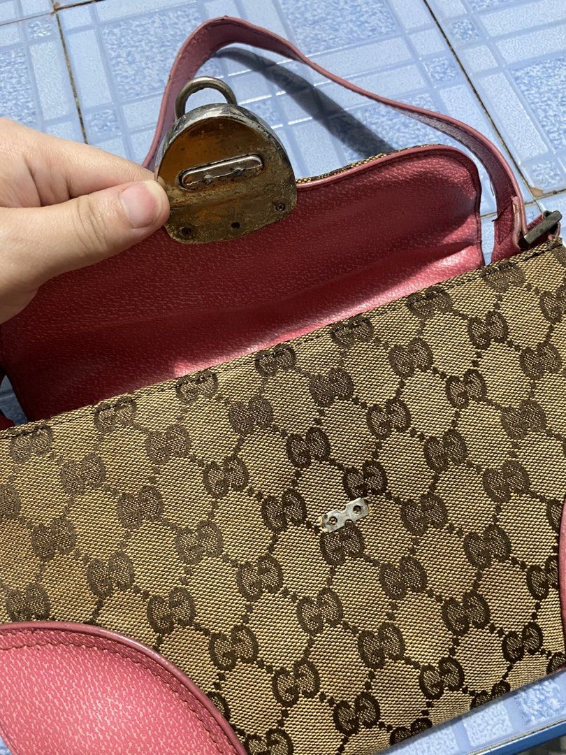 Preloved Vintage Gucci Shoulder Bag (Category: Luxury Bags & Wallets) located in Mandaluyong City. Submitted by sheichichioco (Listing ID 1437786266, Image 3). Description: Selling my preloved Vintage Y2K-style Gucci monogram shoulder bag with pink leather trim Honest issue: Damage front lock Noticeable wear on the hardware and some aging Overall the canvas and shape still look decent. Still useable and can be restored RFS: Decluttering Price is 