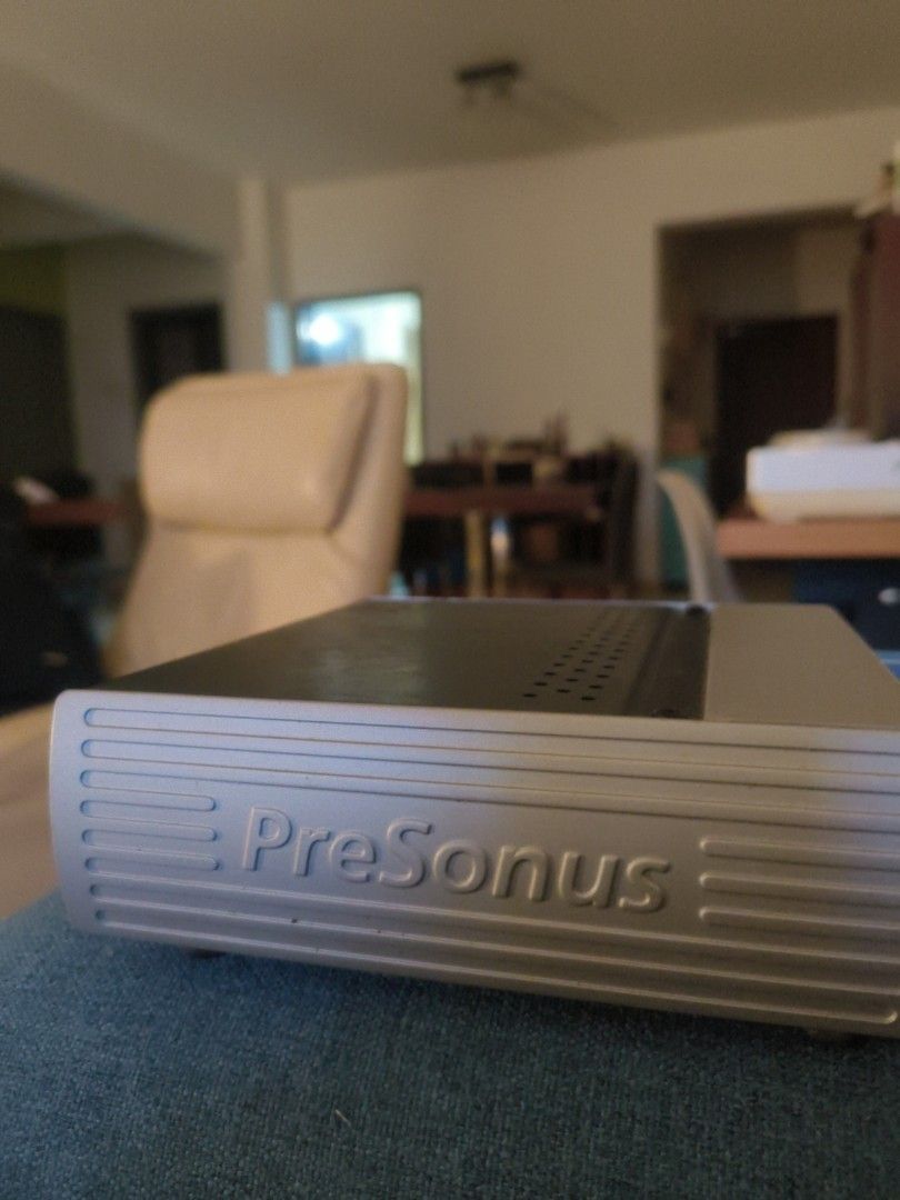 PreSonus Audio Interface (Category: Other Audio Equipment) located in Kuala Lumpur. Submitted by imsamk (Listing ID 1437865813, Image 2). Description: - PreSonus audio interface - Multiple line inputs and outputs - Includes MIDI and S/PDIF ports - Features 1394 ports - Main outs for left and right channels - Sleek silver finish - Ideal for recording and audio production.