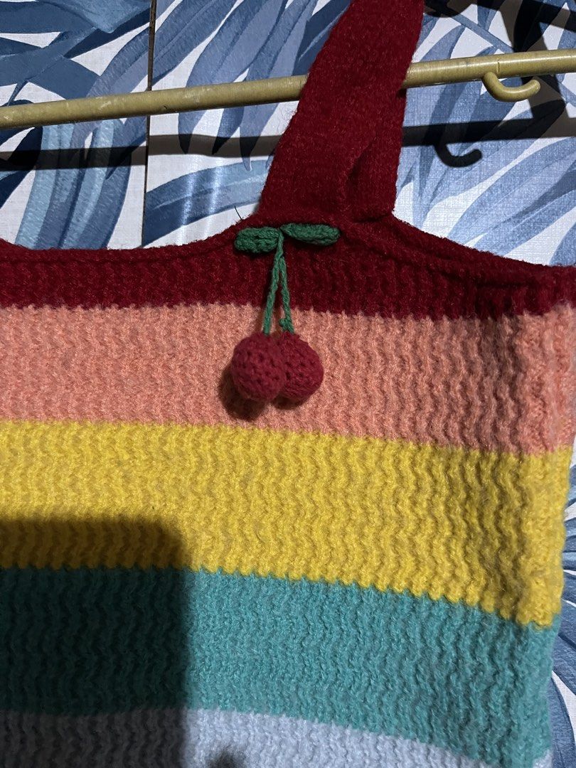 Rainbow Knitted Crop Top with Cherry Details (Category: Others Tops) located in Pasig City. Submitted by rareturtle_829fa7 (Listing ID 1437925275, Image 2). Description: - Rainbow stripe design - Scoop neckline - Tie straps with cherry details - Knitted material - Casual and fun style.