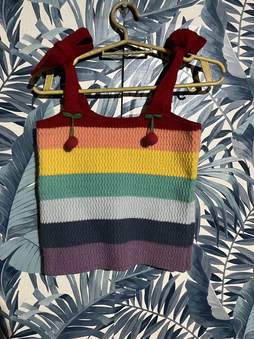 Rainbow Knitted Crop Top with Cherry Details (Category: Others Tops) located in Pasig City. Submitted by rareturtle_829fa7 (Listing ID 1437925275, Image 1). Description: - Rainbow stripe design - Scoop neckline - Tie straps with cherry details - Knitted material - Casual and fun style.