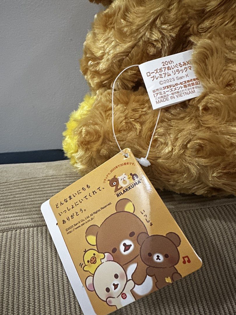 Rilakkuma 20th Anniversary Plush Toy (Category: Plushies & Soft Toys) located in Taguig. Submitted by beerackph (Listing ID 1437925537, Image 3). Description: - Rilakkuma 20th Anniversary Plush - Features a heart-shaped emblem - Unique textured fur - Golden-brown color - Includes original tags - Made in Vietnam.