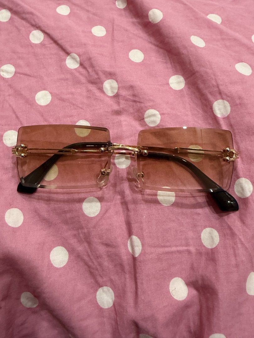 Rimless Sunglasses with Tinted Lenses (Category: Sunglasses & Eyewear) located in Pasig City. Submitted by peonyfield (Listing ID 1437898236, Image 1). Description: - Gold rimless frame - Gradient tinted lenses (dark to light) - Black temples - Stylish and modern design - Perfect for everyday wear.