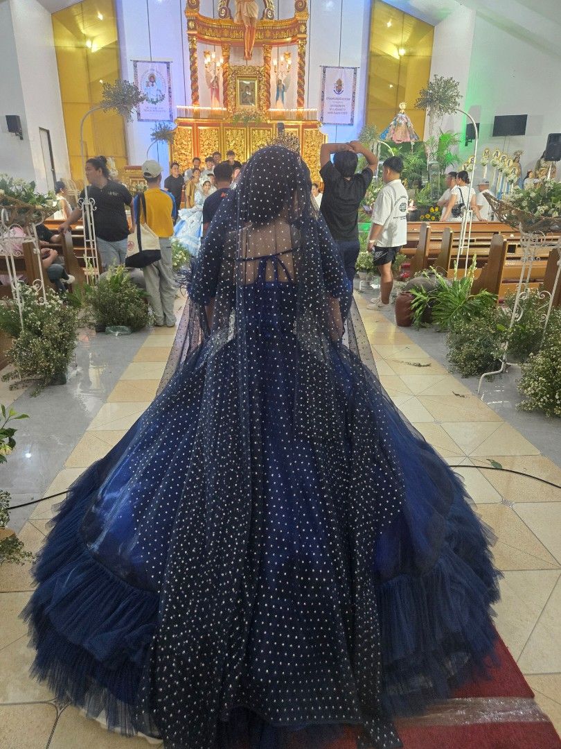 Royal Blue Ball Gown (Category: Evening dresses & gowns) located in Bulacan. Submitted by row01 (Listing ID 1437789228, Image 2). Description: - Elegant royal blue ball gown - Intricate silver detailing - Layered skirt - Matching veil with silver dots - Fitted bodice and full skirt - Includes matching gloves - Ideal for special occasions -Full set ✅️Crown Necklace Earrings Ring Gloves.