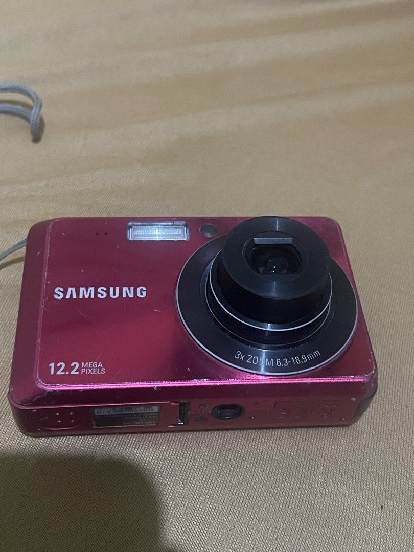 Samsung Digital Camera 12.2MP (Category: Cameras) located in Baguio. Submitted by beygyuu (Listing ID 1437925667, Image 3). Description: - Red Samsung digital camera - 12.2 megapixel resolution - 3x zoom lens - Built-in flash - Screen on the back - Includes wrist strap.
