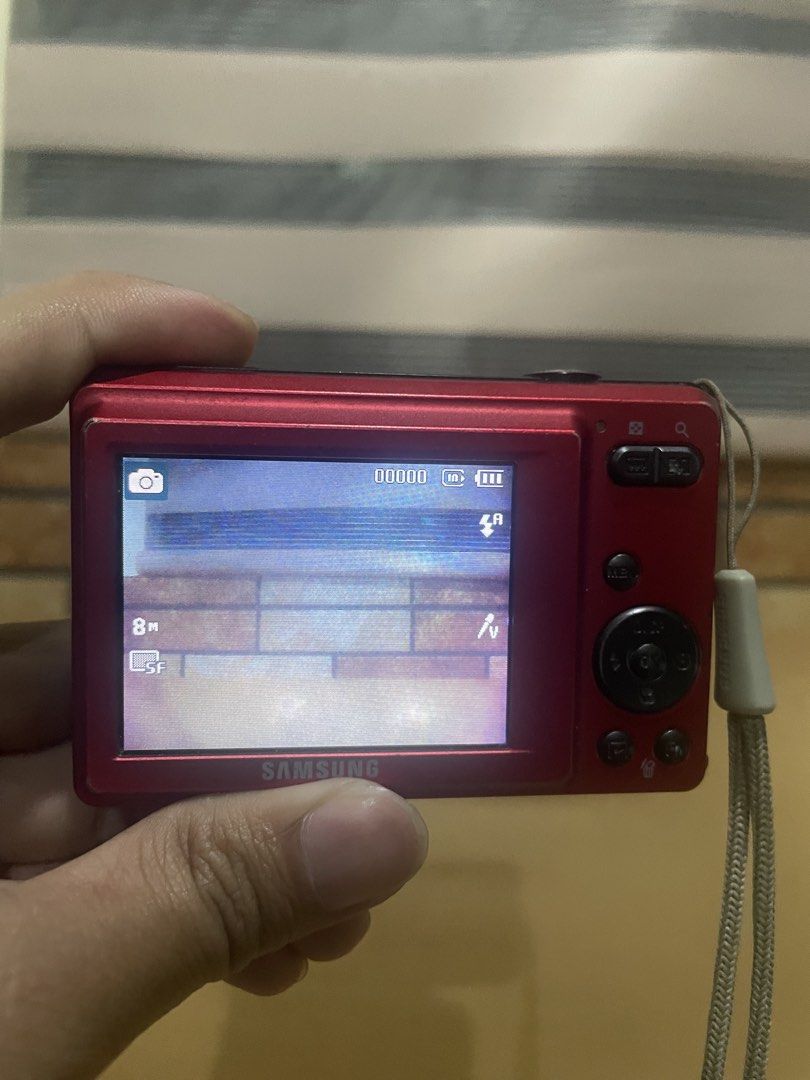 Samsung Digital Camera 12.2MP (Category: Cameras) located in Baguio. Submitted by beygyuu (Listing ID 1437925667, Image 1). Description: - Red Samsung digital camera - 12.2 megapixel resolution - 3x zoom lens - Built-in flash - Screen on the back - Includes wrist strap.