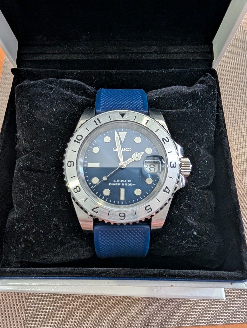 Seiko Mod (Category: Men's Watches) located in Las Pinas. Submitted by carl000000 (Listing ID 1433620688, Image 3). Description: Seiko Submariner Mod Movement: Seiko NH36 Case Diameter: 40mm Strap: 20mm Barton Rubber Strap (will include original metal strap) Sapphire Crystal Additional mod: Exhibition case back and blue rotor.