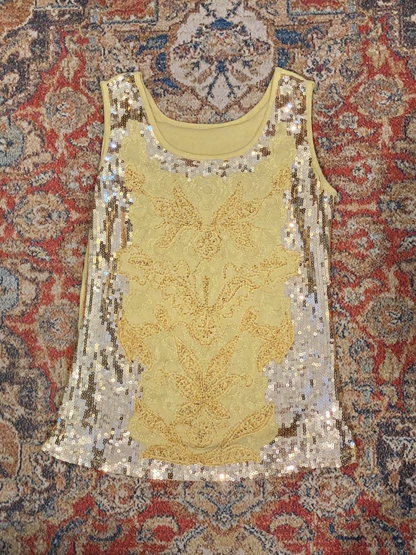 Sequin Embellished Tank Top Gold Large (Category: Sleeveless) located in Manila. Submitted by bels.finds (Listing ID 1437813798, Image 3). Description: - Sequin embellished tank top - Features a detailed design with yellow gold lace overlay on the front - Hannah Montana Vibes!!! - Scoop neckline.