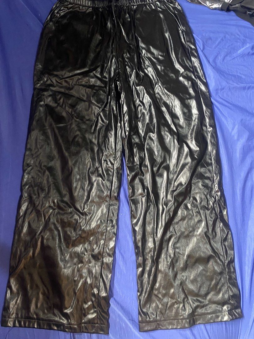 SHEIN Black Faux Leather Pants (Category: Other Bottoms) located in Manila. Submitted by girlzluhdev (Listing ID 1437844513, Image 1). Description: - SHEIN black faux leather pants - Wide leg design - Drawstring waist - Size: L (EU 40/42, US 8/10) - Made in China - Condition: Good.