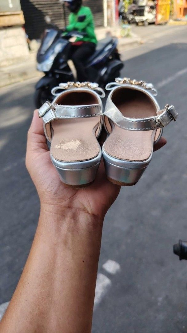Shein Silver Slingback Sandals with Embellishments (Category: Flats & Sandals) located in Manila. Submitted by fheyyy_02 (Listing ID 1437878394, Image 3). Description: - Silver slingback sandals - Size 33 - Pointed toe design - Decorative embellishment - Small heel - Buckle closure - Pre-owned condition (soles show wear).