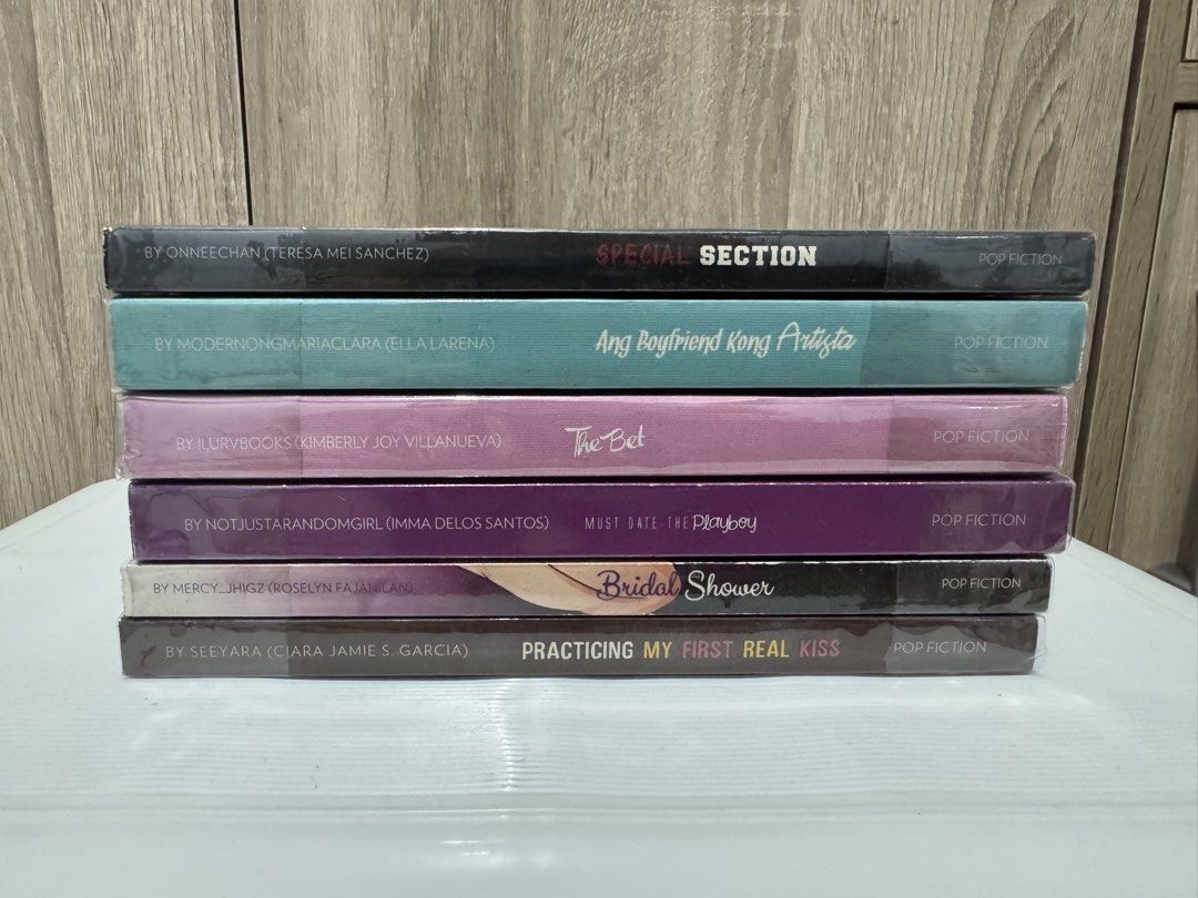 [Take All] Pop Fiction Books (Category: Storybooks) located in Polangui. Submitted by prlvdbymnc_ (Listing ID 1437793568, Image 1). Description: - Selling as set only - 6 Pop Fiction book set - Titles included: "Special Section", "Ang Boyfriend Kong Artista", "The Bet", "Must Date the Playboy", "Bridal Shower", and "Practicing My First Real Kiss" - Ideal for readers and collectors - Condition: 9/10 still with bookmarks & with plastic cover. Kindl