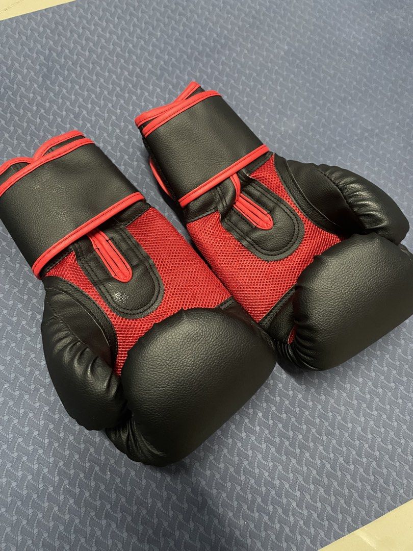 UFC Muay Thai/Boxing Gloves 12oz (Category: Combat Sports) located in Cebu City. Submitted by gene.cartz (Listing ID 1437857641, Image 3). Description: - no issues - only used for a week during my trial muay thai training - no odor—i sanitized these every after training and wore hand wraps - inclusions: original ufc bag - loc: general santos city - rfs: bought a pair of heavier gloves from my coach .