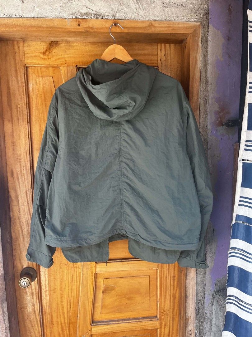 Undercover x Gu 2-Way Oversized Mod Coat Olive (Category: Coats, Jackets and Outerwear) located in Maasin. Submitted by trippythirftyyy (Listing ID 1437799184, Image 2). Description: - Olive green GU x Undercover hooded jacket - Size: S - Features: Drawstring hood, multiple pockets, button-up closure - Details: Chest and bottom patches with text -complete tags -missing lower part , hoodie only available .
