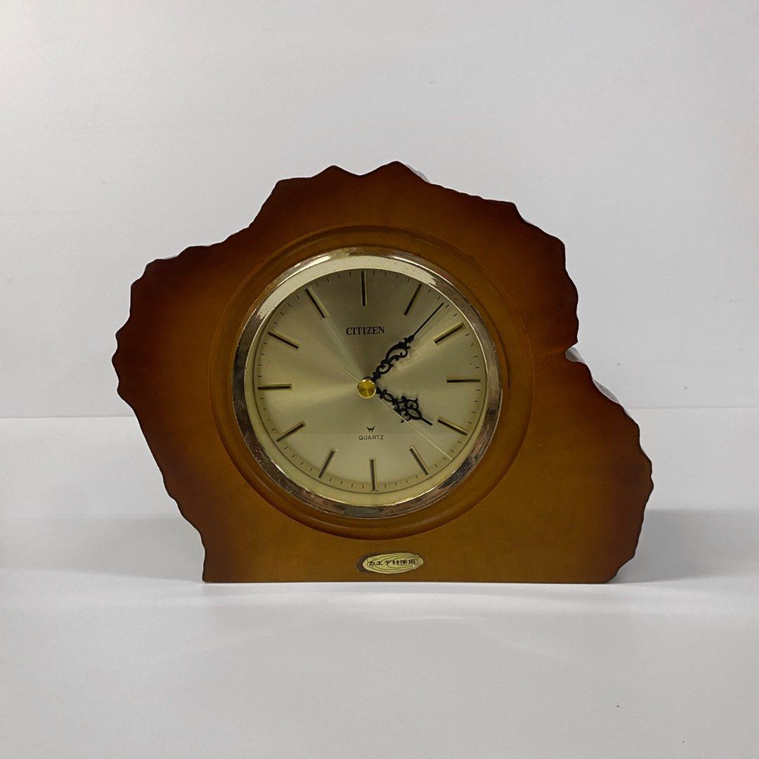 Vintage Citizen Shelf Wood Table Clock - Medium (Category: Clocks) located in Bacolod City. Submitted by bt_ph (Listing ID 1437766423, Image 1). Description: - Vintage Citizen shelf clock - working - Made in Japan - 9 x 7 inch dimensions - 2 inch thick wood - Gold-toned clock face with black hands - Quartz movement - Unique, wood frame - Battery compartment at the back .