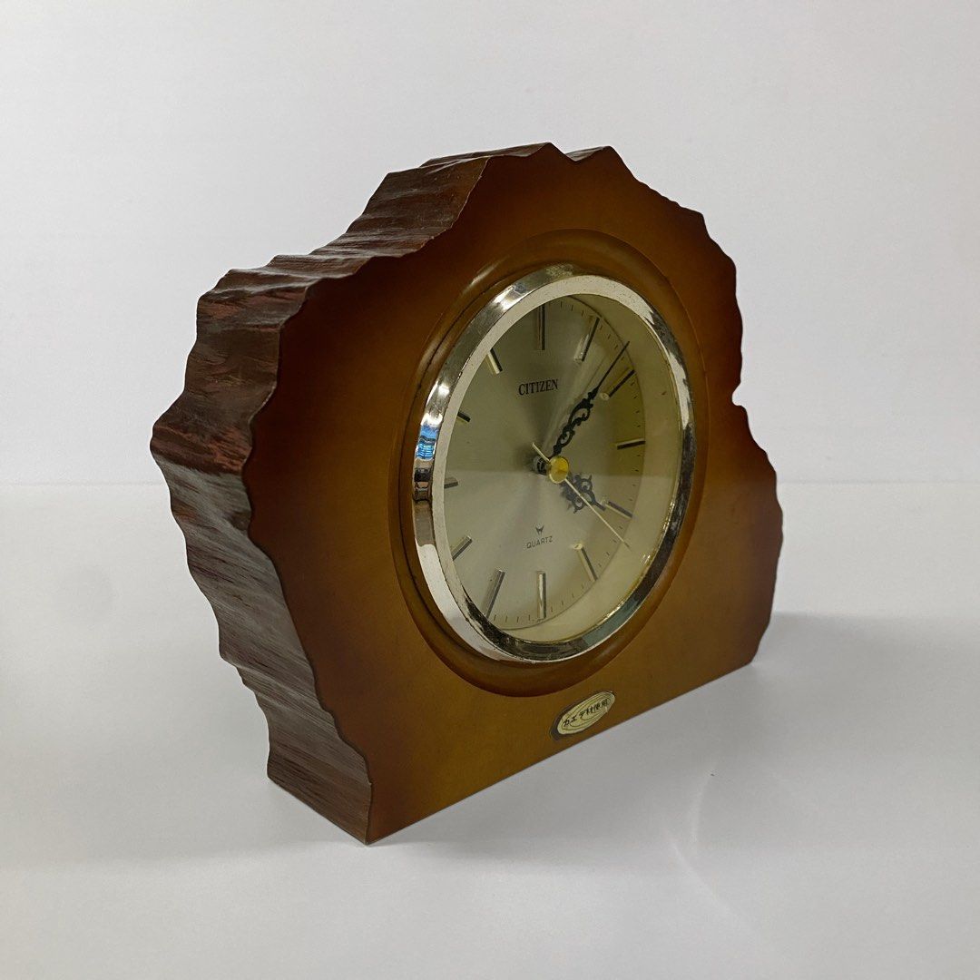 Vintage Citizen Shelf Wood Table Clock - Medium (Category: Clocks) located in Bacolod City. Submitted by bt_ph (Listing ID 1437766423, Image 3). Description: - Vintage Citizen shelf clock - working - Made in Japan - 9 x 7 inch dimensions - 2 inch thick wood - Gold-toned clock face with black hands - Quartz movement - Unique, wood frame - Battery compartment at the back .