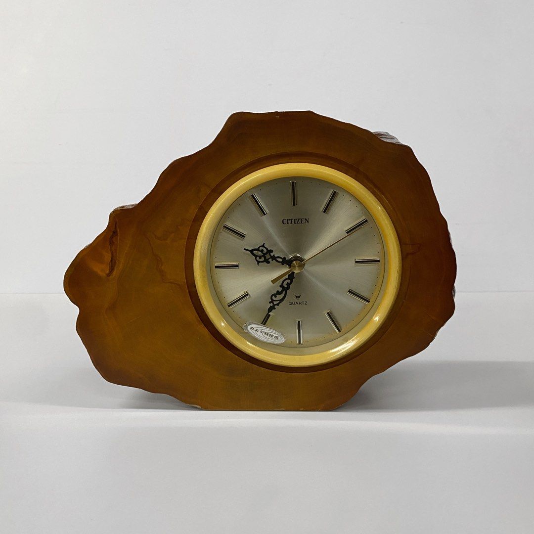 Vintage Citizen Shelf Wood Table Clock - Large (Category: Clocks) located in Bacolod City. Submitted by bt_ph (Listing ID 1437767676, Image 1). Description: - Vintage Citizen shelf clock - 10 x 8 dimensions - 2.5 inch thick - Silver clock face with gold accents - Unique, organic-shaped wooden frame - Black back - Made in Japan - In good working condition.
